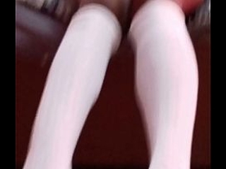 Naked student in white socks and student black shoes gives teacher a shoe job